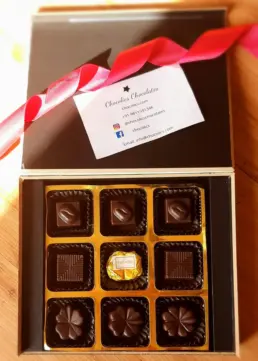 Corporate chocolate gift box with logo branding and gold wrap
